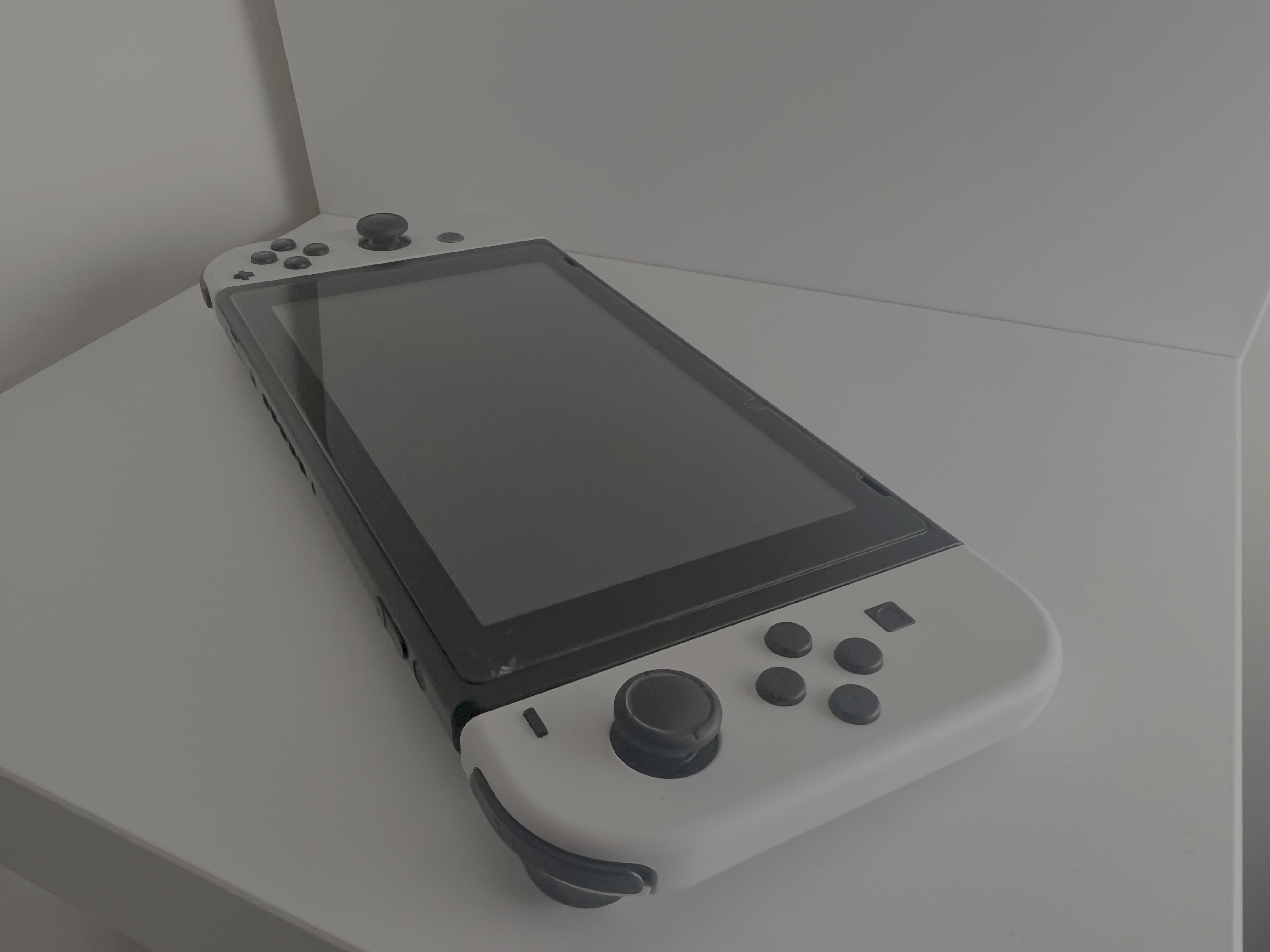 Chosen to give a three-quarter perspective of the Switch. This angle helps visualize depth and how buttons sit on the device’s surface.